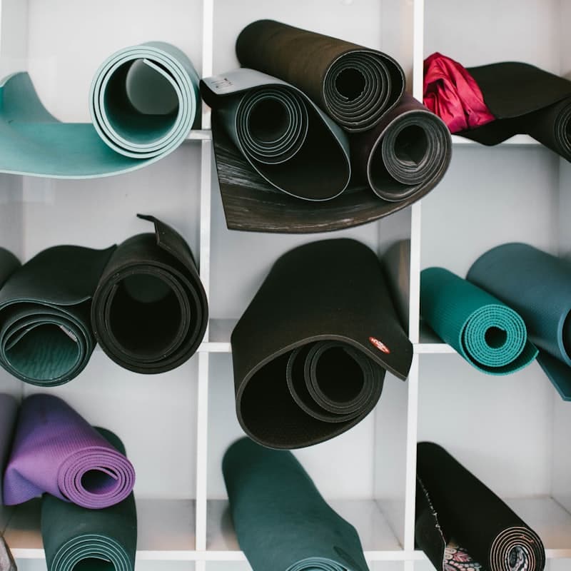 Rolled mats stacked on a shelf